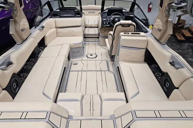 Slide: The Image of Luxurious 2026 Supra SL boat interior with beige seating and modern dashboard. - 13