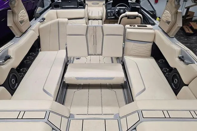 Slide: The Image of Luxurious interior of 2026 Supra SL boat with beige seating and modern design. - 14