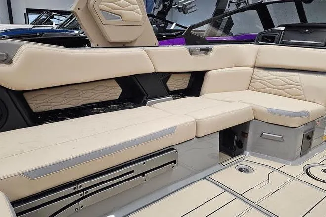 Slide: The Image of Luxurious interior of a 2026 Supra SL boat with beige leather seating. - 19