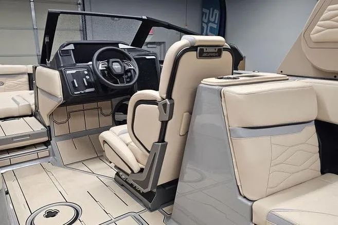 Slide: The Image of 2026 Supra SL boat interior with beige seating and modern dashboard design. - 20