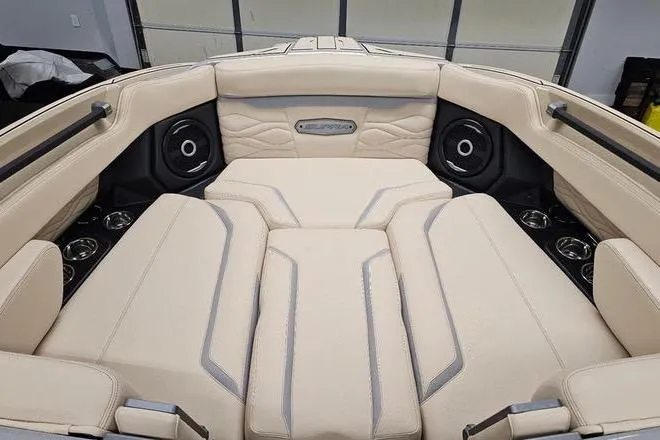 Slide: The Image of Luxurious interior of 2026 Supra SL boat with beige seating and integrated speakers. - 21