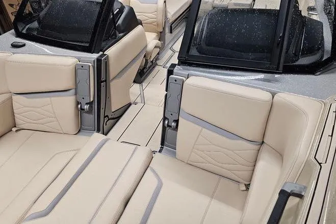 Slide: The Image of 2026 Supra SL boat interior with beige leather seating and modern design. - 22