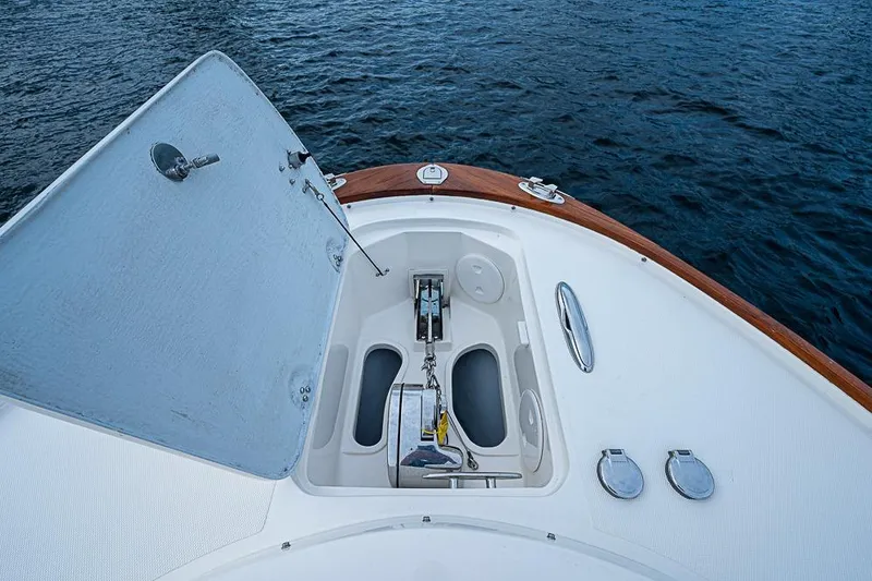 Slide: The Image of 2018 Hunt Yachts 32 Center Console anchor compartment on calm water. - 15
