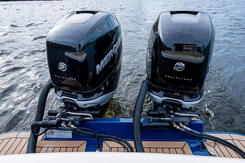 Slide: The Image of Twin Mercury outboard engines on a 2018 Hunt Yachts 32 Center Console boat. - 19