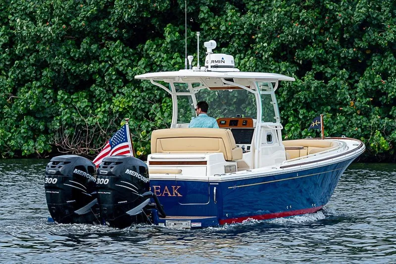 Slide: The Image of 2018 Hunt Yachts 32 Center Console cruising with dual Mercury engines. - 3