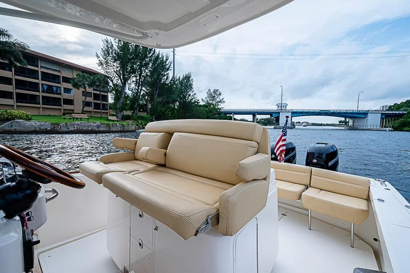 Slide: The Image of 2018 Hunt Yachts 32 Center Console on a scenic waterway with bridge view. - 5