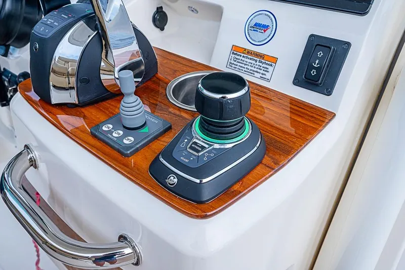 Slide: The Image of Control panel of 2018 Hunt Yachts 32 Center Console with joystick and throttle. - 9