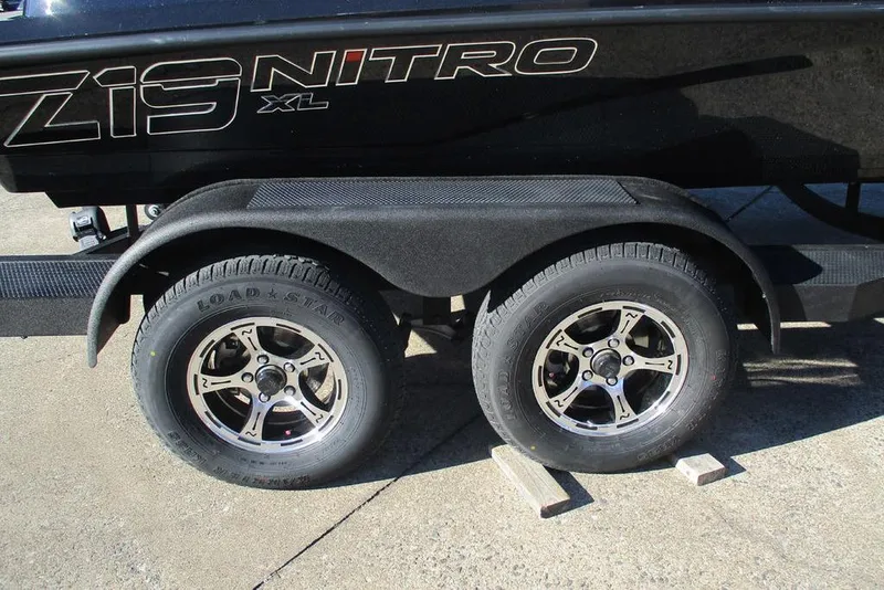 Slide: The Image of 2026 Nitro Z19 XL Pro trailer with dual wheels on concrete surface. - 10