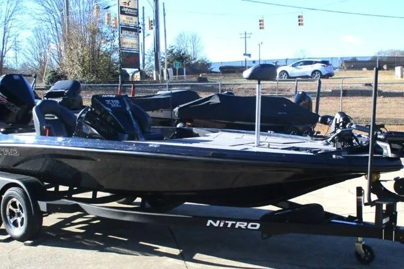 Slide: The Image of 2026 Nitro Z19 XL Pro boat on trailer in outdoor setting. - 11