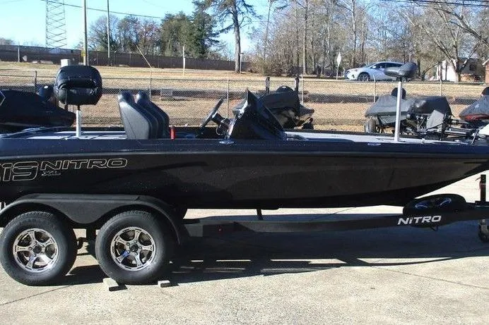 Slide: The Image of 2026 Nitro Z19 XL Pro boat on trailer, parked outdoors. - 4