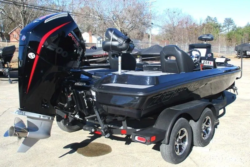 Slide: The Image of 2026 Nitro Z19 XL Pro boat with powerful engine, parked on a trailer. - 6