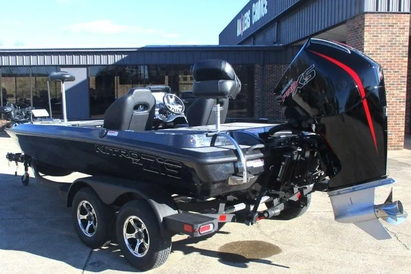 Slide: The Image of 2026 Nitro Z19 XL Pro boat with powerful outboard motor, parked on a trailer. - 7