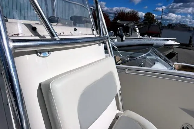 Slide: The Image of 2020 Cobia 237 Center Console boat with sleek seating and stainless steel details. - 2