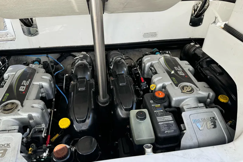 Slide: The Image of 2013 Cobalt 336 boat engine compartment with dual 8.2L Mercury V8 engines. - 12