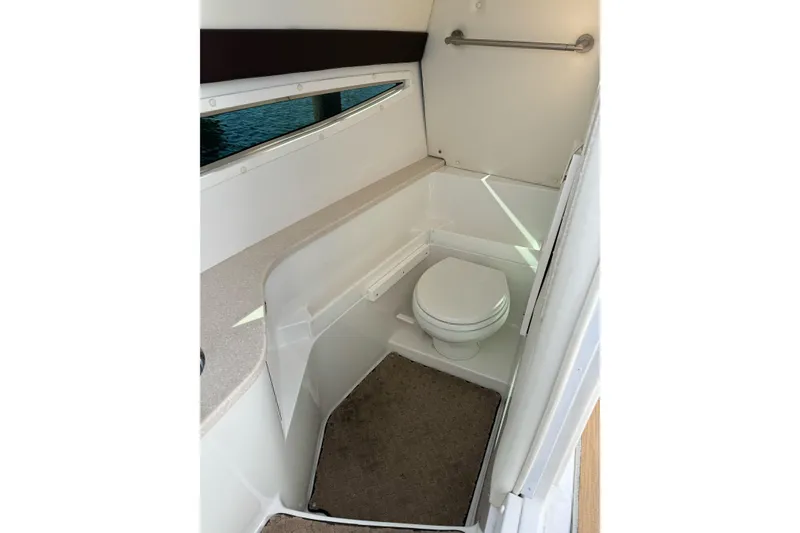 Slide: The Image of 2013 Cobalt 336 boat interior bathroom with toilet and countertop. - 15