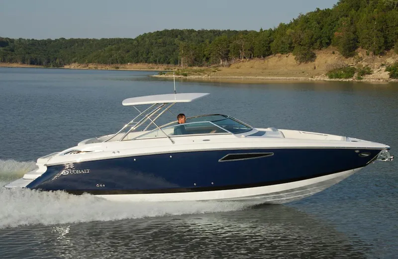 Slide: The Image of Manufacturer Provided Image: 2013 Cobalt 336 boat cruising on a lake with forested shoreline. - 16