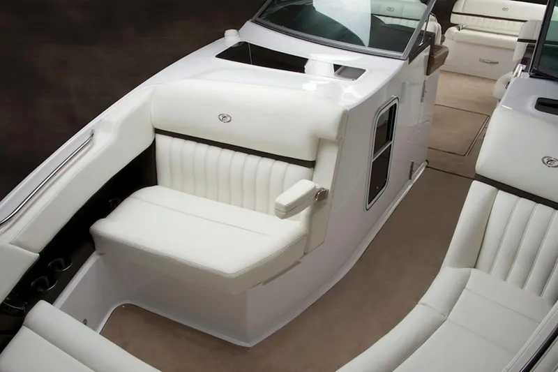 Slide: The Image of Manufacturer Provided Image: 2013 Cobalt 336 boat interior with white leather seating and beige carpet. - 21