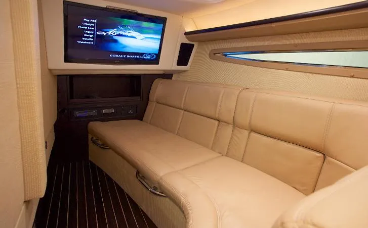 Slide: The Image of Manufacturer Provided Image: Luxurious interior of 2013 Cobalt 336 boat with leather seating and flat-screen TV. - 23