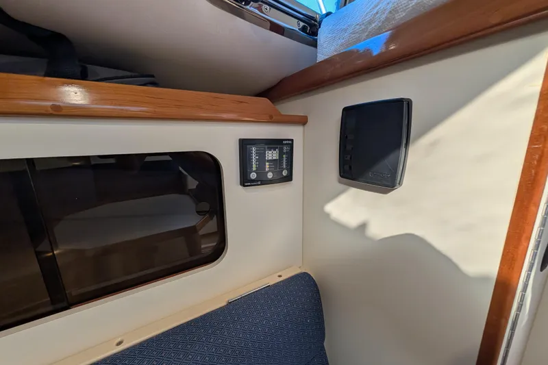 Slide: The Image of Interior of 2004 Albin 30 Family Cruiser with control panel and window. - 12