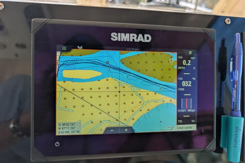 Slide: The Image of Simrad navigation display on 2004 Albin 30 Family Cruiser, showing nautical chart and coordinates. - 15