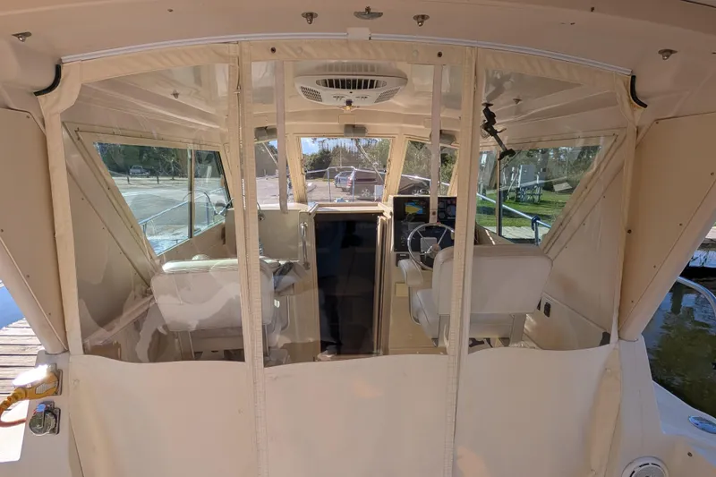 Slide: The Image of Interior view of a 2004 Albin 30 Family Cruiser boat with beige seating. - 21