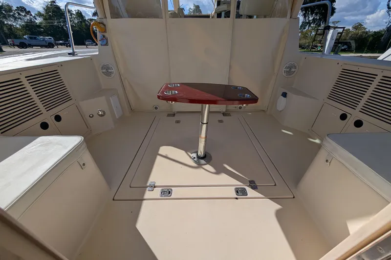 Slide: The Image of 2004 Albin 30 Family Cruiser interior with seating and table, showcasing spacious design. - 24