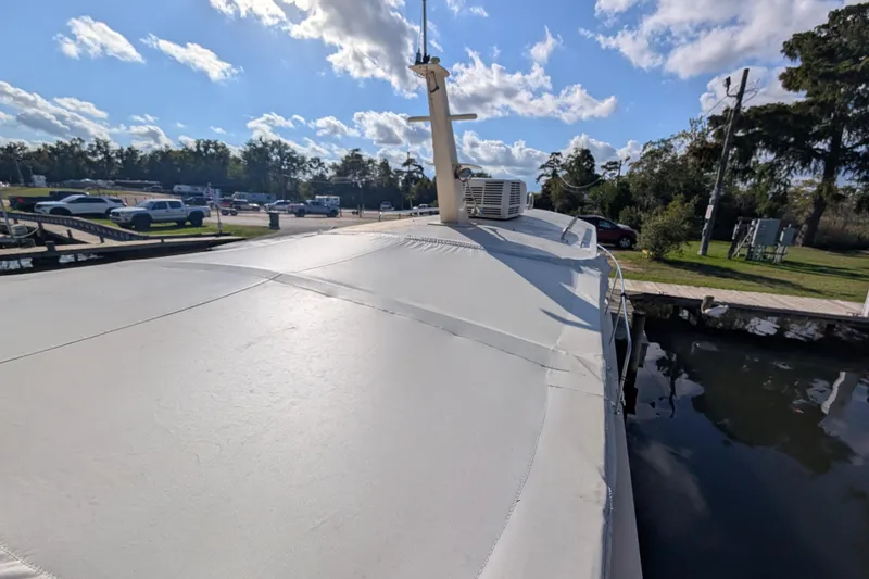 Slide: The Image of 2004 Albin 30 Family Cruiser docked under a sunny sky. - 34