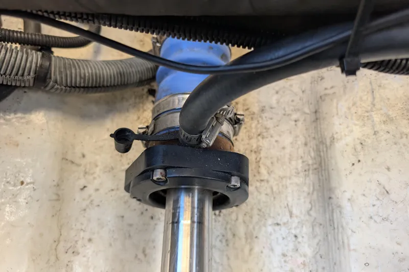 Slide: The Image of Close-up of a 2004 Albin 30 Family Cruiser's engine component with hoses and clamps. - 57