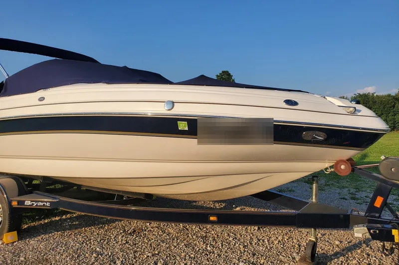 Slide: The Image of 2007 Bryant 219 boat on trailer in sunny weather. - 1