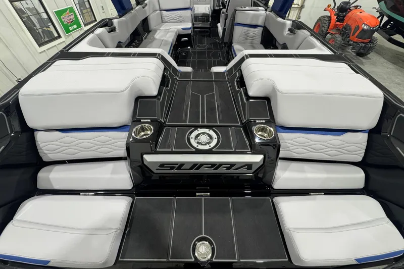 Slide: The Image of 2026 Supra SL boat interior with luxurious seating and modern design. - 6