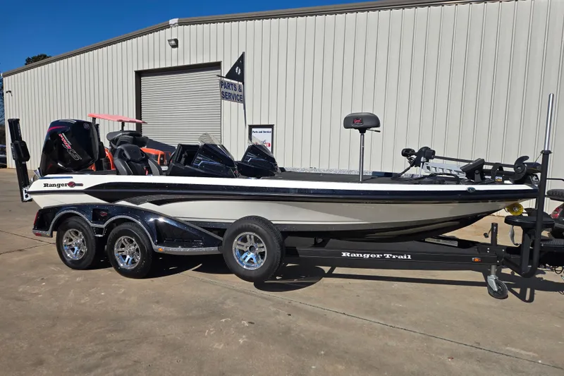 The Image of 2022 Ranger Z520R boat on trailer outside service center. - 1