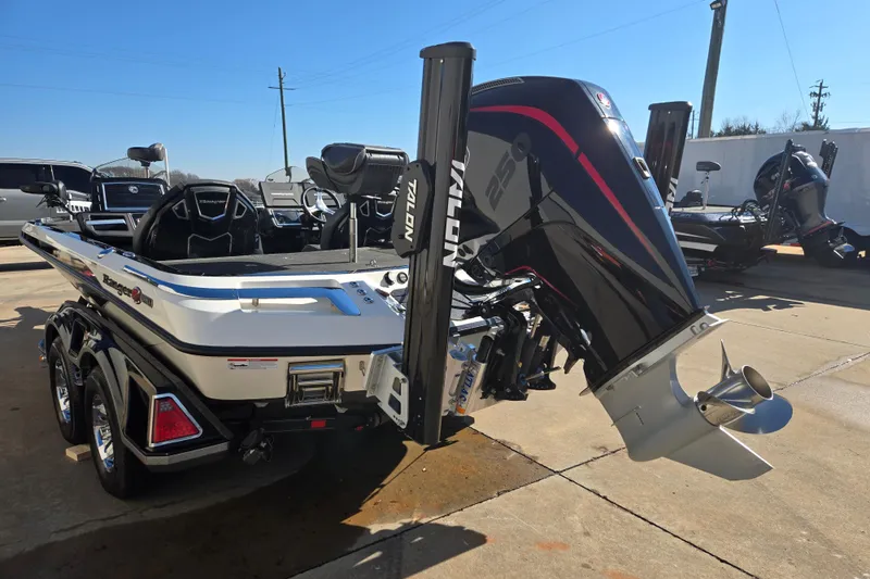 Slide: The Image of 2022 Ranger Z520R boat with powerful outboard motor, parked outdoors on a sunny day. - 5