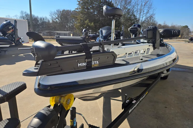 Slide: The Image of 2022 Ranger Z520R boat with Minn Kota Ultrex trolling motor, parked outdoors. - 8