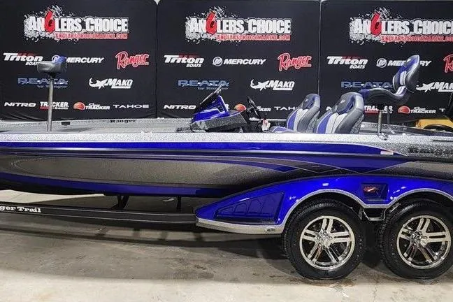 The Image of 2026 Ranger Z521R Cup-Equipped boat in showroom, featuring sleek design and dual seats. - 1