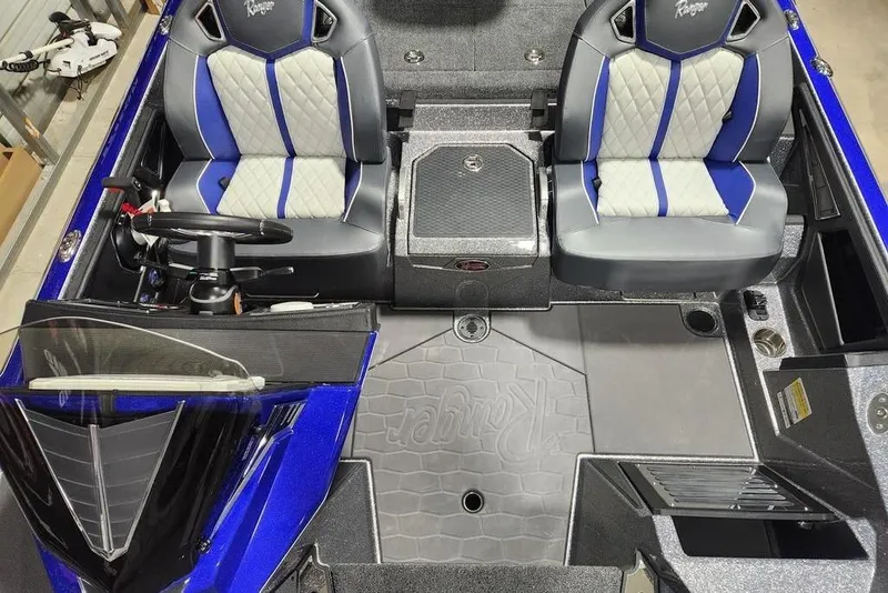 Slide: The Image of 2026 Ranger Z521R Cup-Equipped boat interior with dual seats and steering wheel. - 14