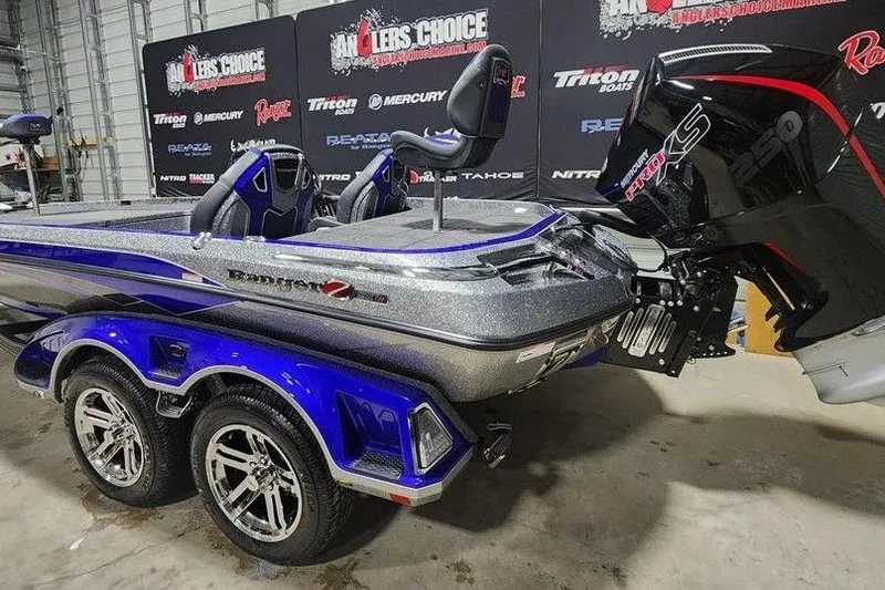 Slide: The Image of 2026 Ranger Z521R Cup-Equipped boat with dual axle trailer in showroom. - 4