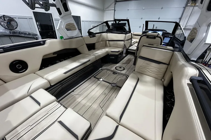 Slide: The Image of Luxurious interior of 2026 Supra SE boat with beige seating and modern design. - 10