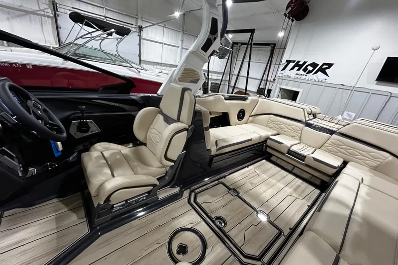 Slide: The Image of 2026 Supra SE boat interior with luxurious beige seating and modern design. - 8