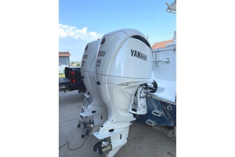 Slide: The Image of Twin Yamaha outboard engines on a 2005 Southport 28 Center Console boat. - 15