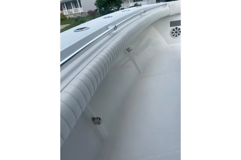 Slide: The Image of 2005 Southport 28 Center Console boat interior with cushioned seating and speaker. - 20