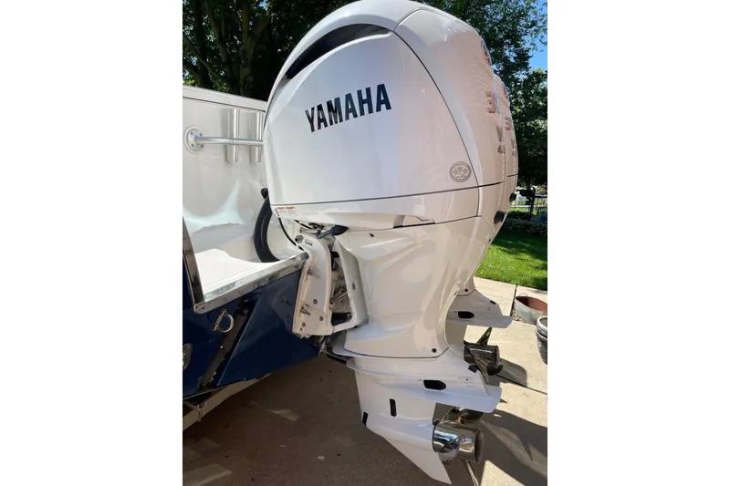 Slide: The Image of Yamaha outboard motor on 2005 Southport 28 Center Console boat, parked outdoors. - 21