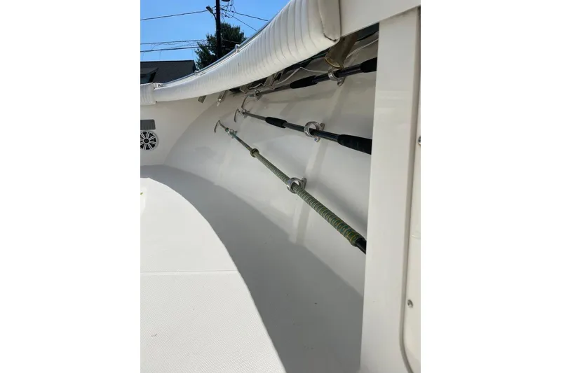Slide: The Image of 2005 Southport 28 Center Console boat interior with fishing rod holders. - 28