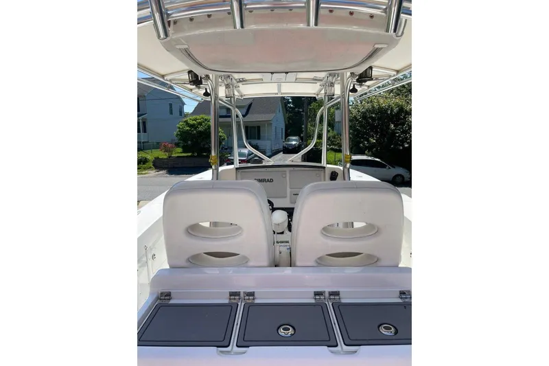 Slide: The Image of 2005 Southport 28 Center Console boat interior with dual seats and control panel. - 32