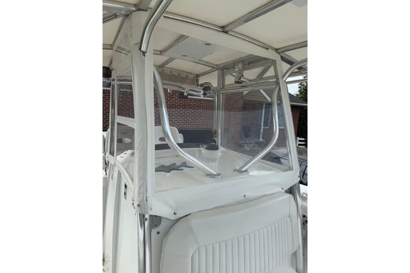 Slide: The Image of 2005 Southport 28 Center Console boat with enclosed helm and seating. - 34