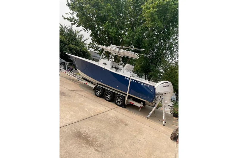Slide: The Image of 2005 Southport 28 Center Console boat on trailer, parked outdoors. - 9