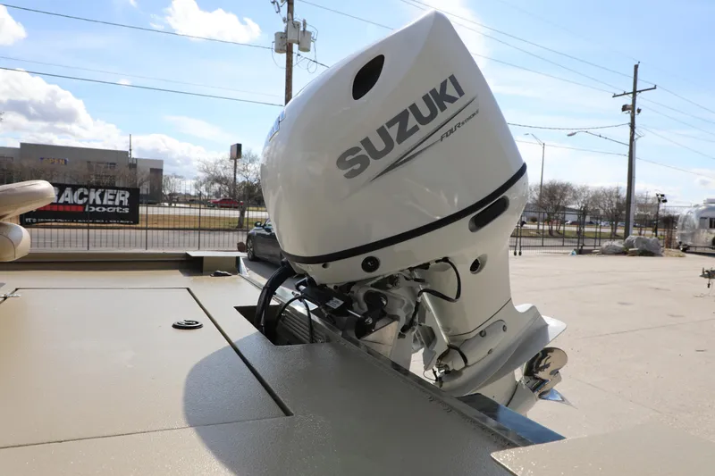 Slide: The Image of Boat with Suzuki outboard motor, Xtreme 2072 model, 2025, parked outdoors. - 5