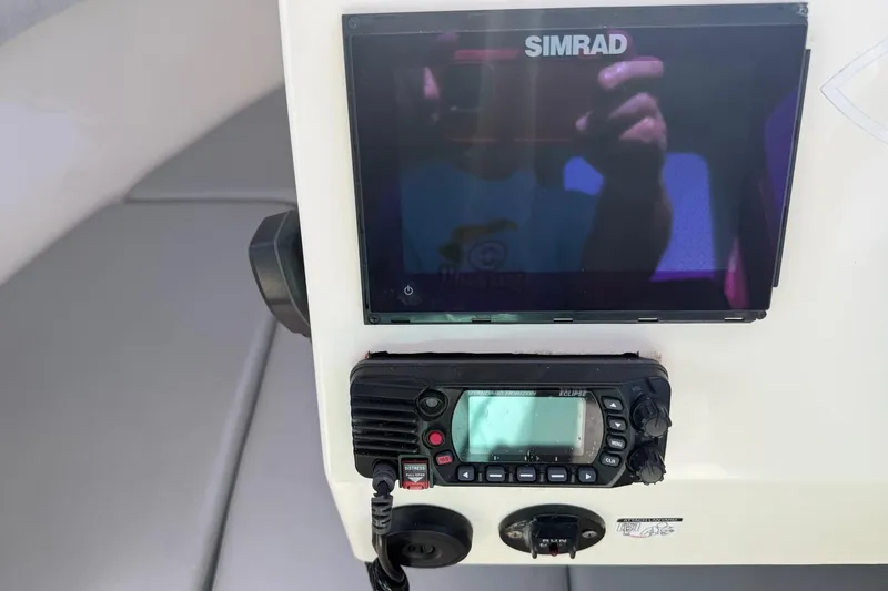 Slide: The Image of Simrad display and radio equipment on 2021 Defiance Admiral 220 EX boat. - 13