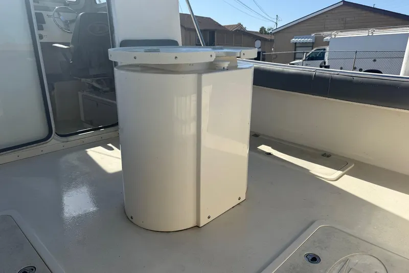 Slide: The Image of 2021 Defiance Admiral 220 EX boat interior with seating and steering wheel. - 7