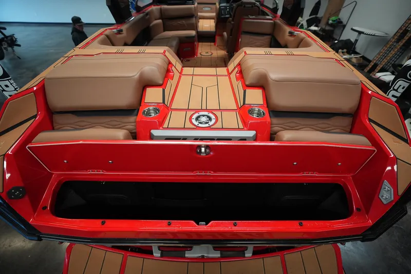 Slide: The Image of 2026 Supra SA boat interior with red and tan seating, cup holders, and sleek design. - 11