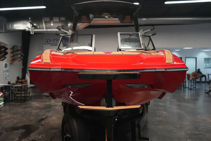 Slide: The Image of 2026 Supra SA boat in showroom, vibrant red exterior, sleek design. - 4
